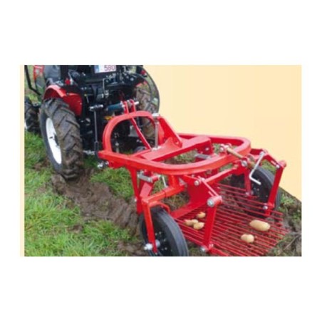 Arracheuse de pommes de terre avec éjection laérale pour micro tracteur
